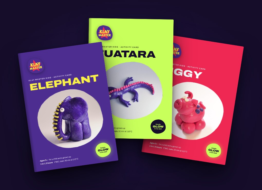 Three A5 activity cards fanned out: Elephant, Tuatara and Piggy