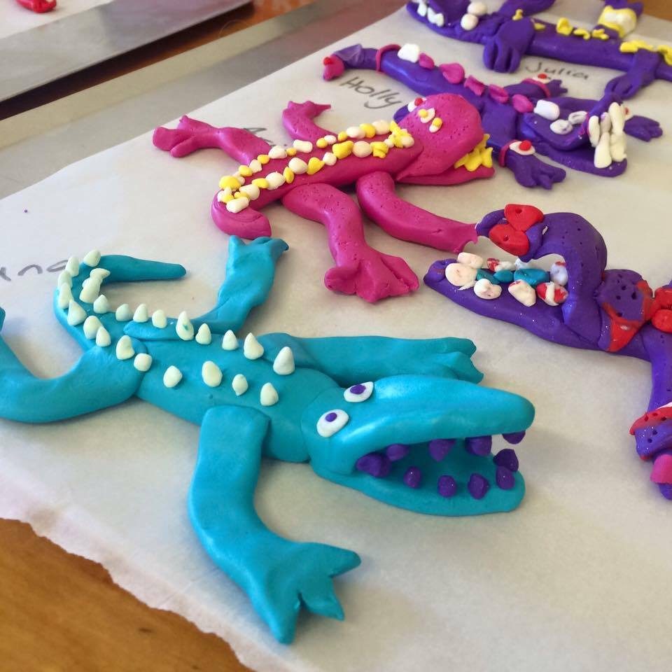 Clay crocodiles and lizards on a table