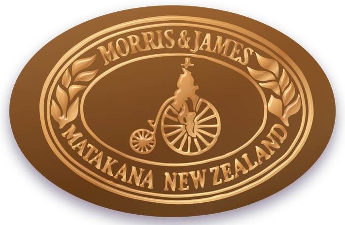 Bronze Morris & James emblem magnet on a fridge